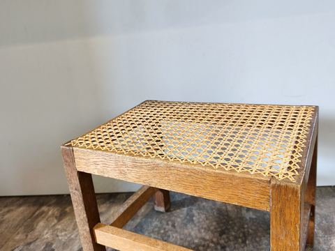 Hand-caned oak stool — angle view