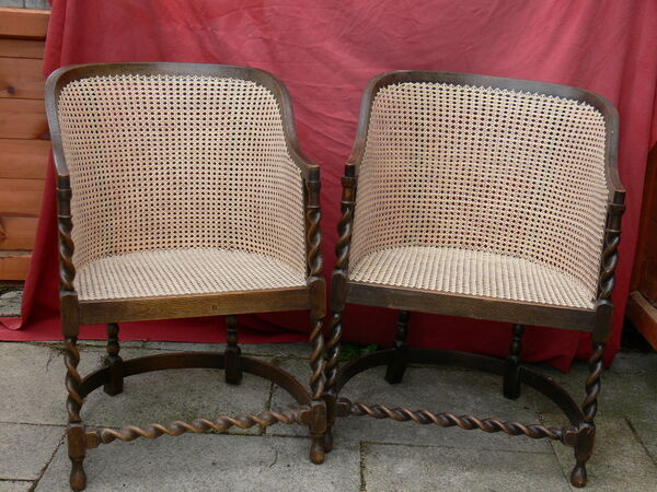 Pair of Jacobean-style oak armchairs with barley-twist legs and stretchers, freshly caned seats and curved backs — restoration complete