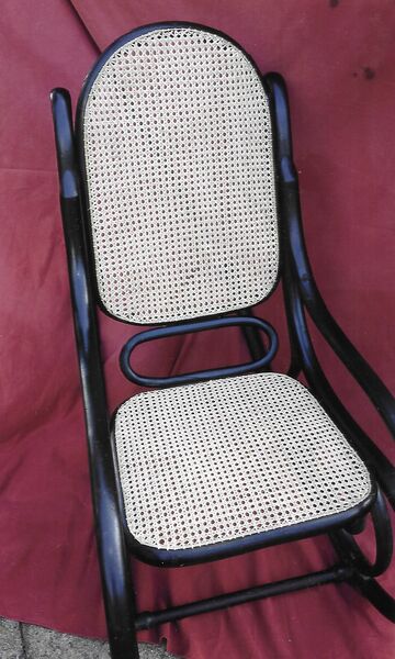 Ebonised black bentwood rocking chair with re-caned oval seat and back panels — restoration complete