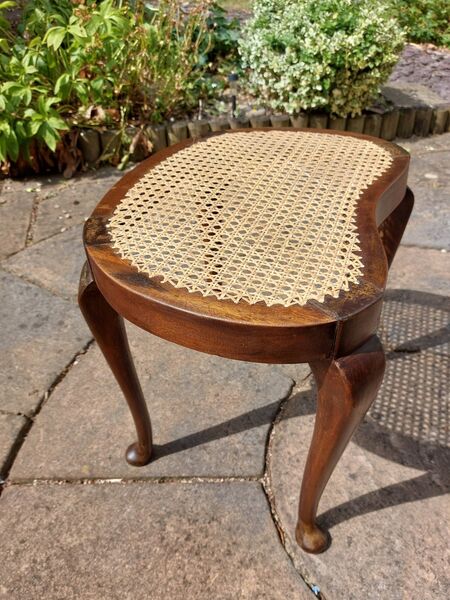 Queen Anne style footstool with freshly hand-caned oval top on cabriole legs — after restoration
