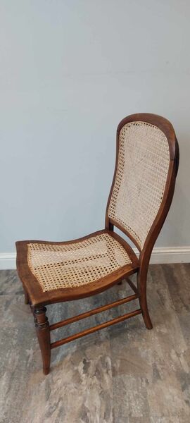 Victorian side chair with hand-caned seat and back, walnut frame, turned front legs — full view